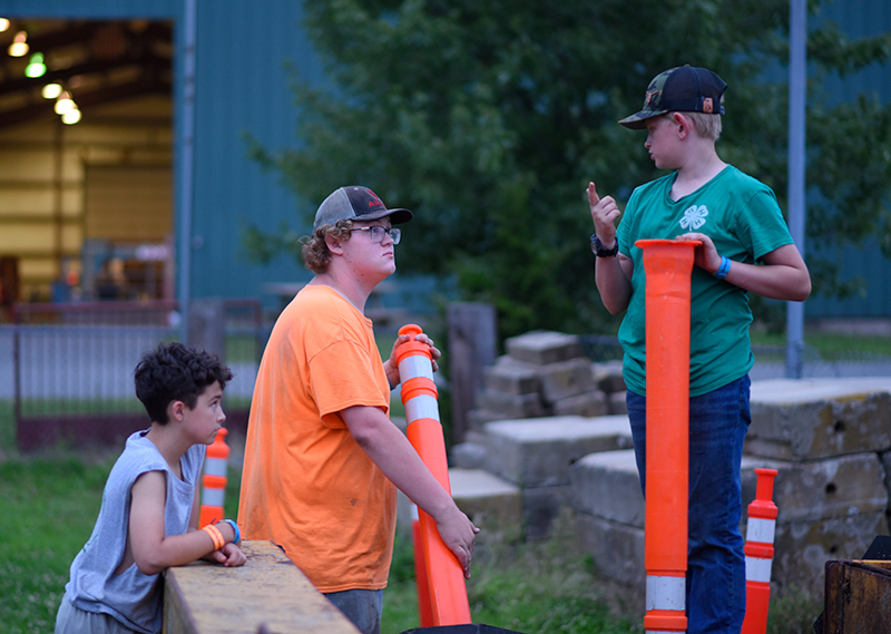 boys putting cones away in evening